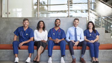 five-healthcare-workers-sitting-in-hospital-full-utc